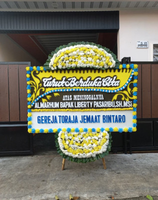 Papan Bunga Duka di Gunung Woka
